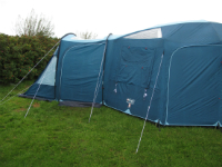 Tent pitched alongside hedges
