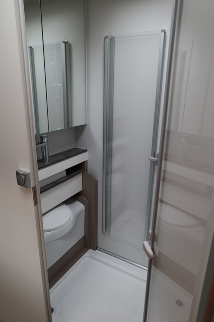 Motorhome: Frankia M-Line Neo's new washroom showing the toilet and sink slid away
