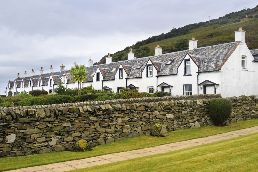 Image of a row of fishing cottages in Catacol, known as The Twelve Apostles