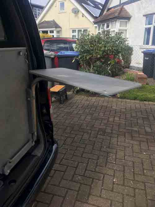 Campervan table fixed in the upper rear position