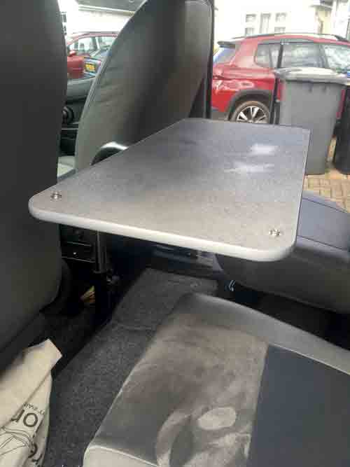 Campervan table located behind the cab seats