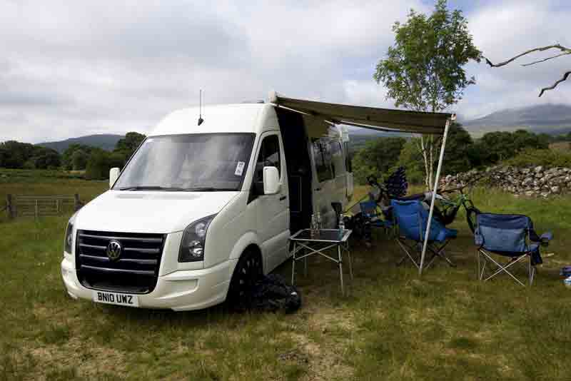 Image of an awning and a campervan