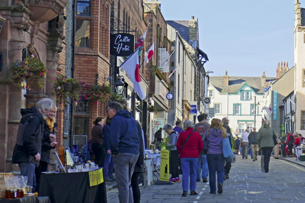 Conwy Honey Fair with stalls and lots of shoppers