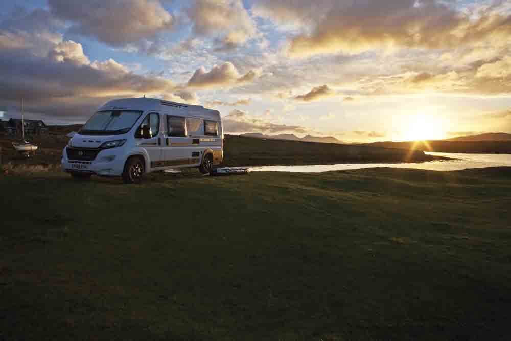 Image of a campervan in the sunset