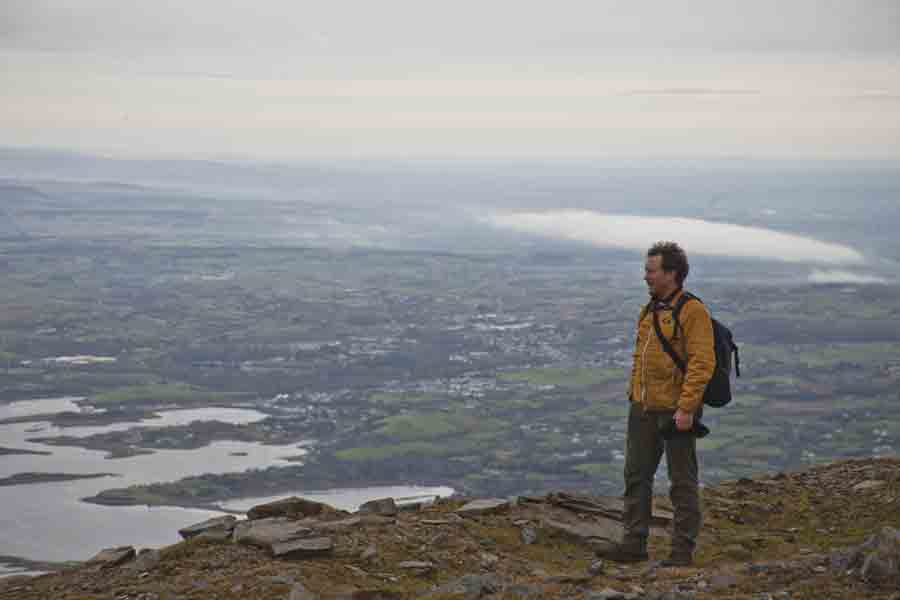Image of a walker at the top of Croagh Patrick, western Ireland