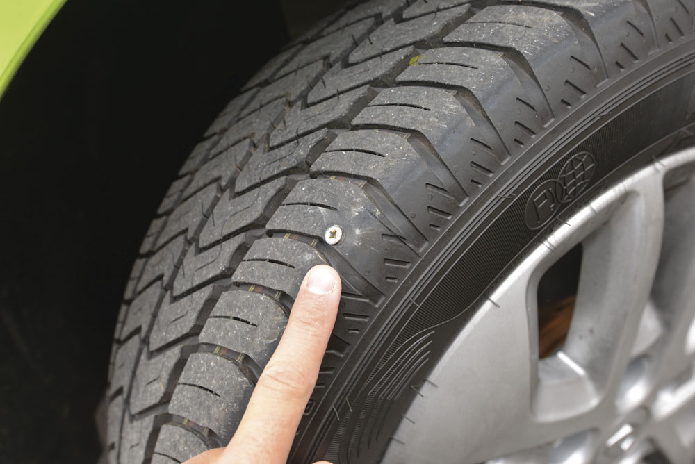 A motorhome tyre with a nail in it