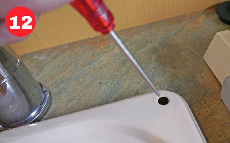 Explore the existing fixing holes using a pointed instrument