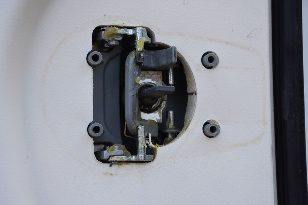 Remove screws from caravan door lock