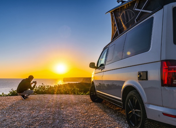 Campervan overlooking a sunset