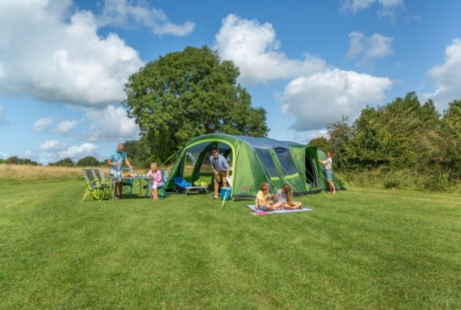 A family using the Weathermaster 6XL Air BlackOut tent