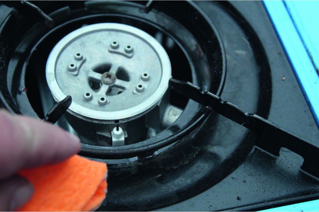 Cleaning a camping stove