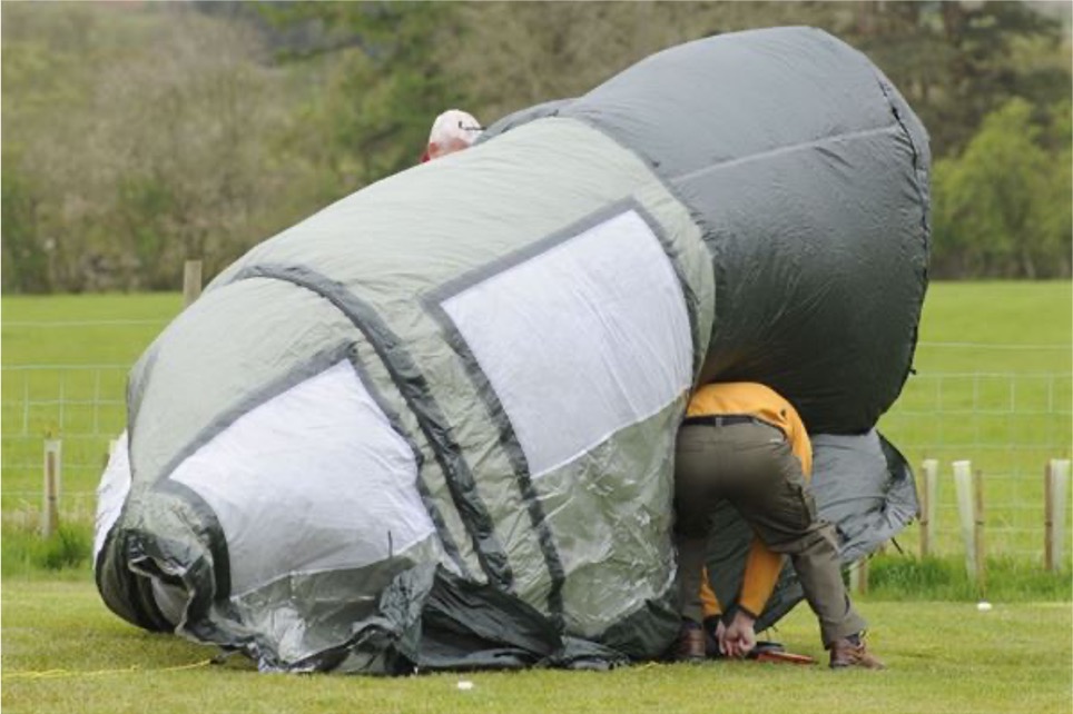 Pitching a tent in windy weather