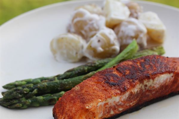 Spicy rubbed salmon fillets with potato salad