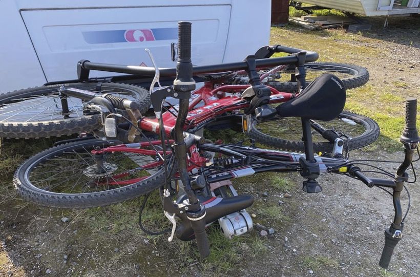 An A-frame bike rack on the back of a caravan