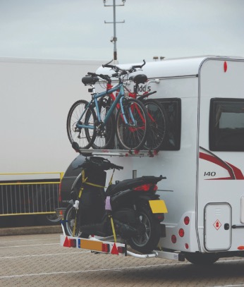 A bike rack for scooters and bicycles on a motorhome