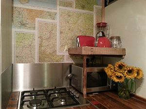 The gas hob with maps on the wall The gas hob with maps on the wall