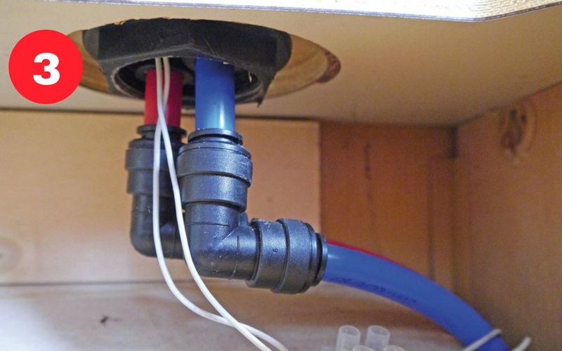  Beneath the tap the push-fit plumbing and wiring will need disconnection.