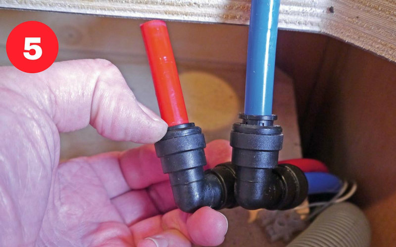 Press black release ring on the plumbing fittings to withdraw the pipe.