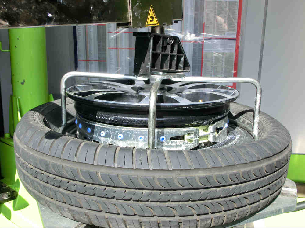 Cage pushes tyre out of way