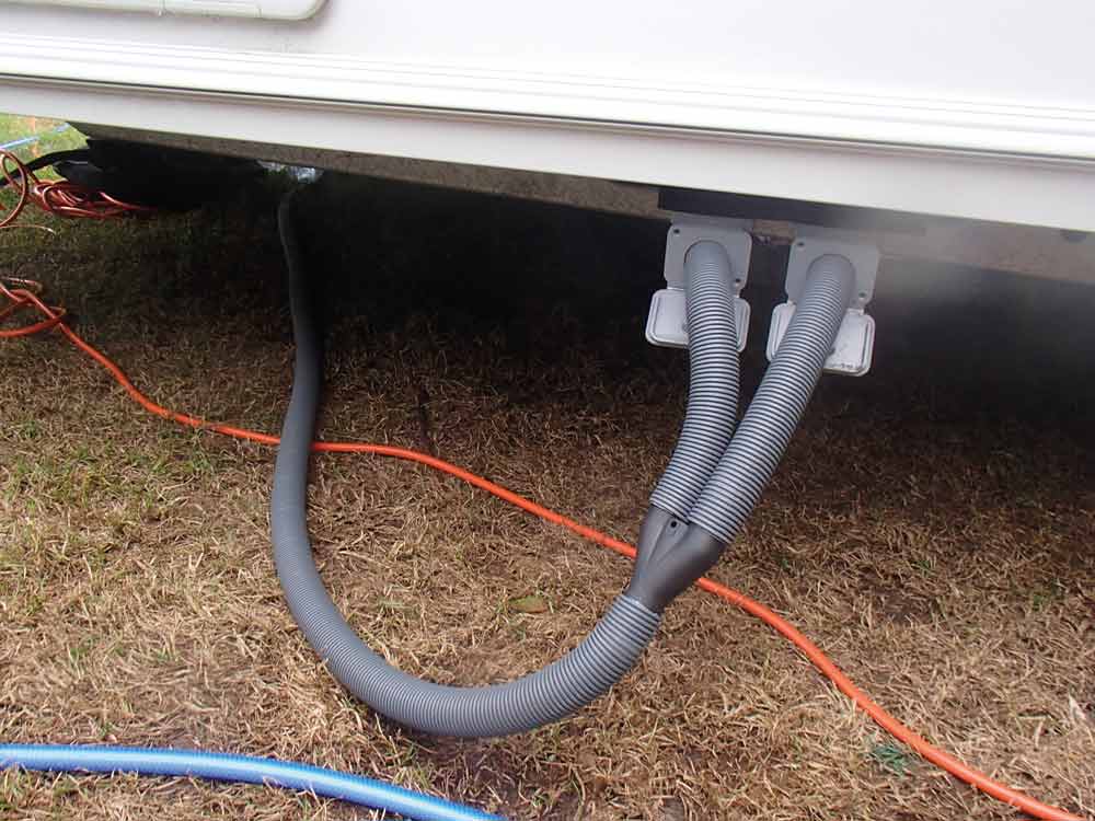 grey waste pipes on a caravan