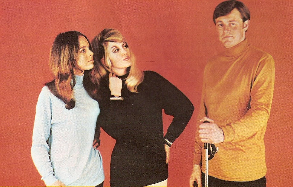 Two women and a man wearing 70’s fashion clothing Two women and a man in 70’s clothing