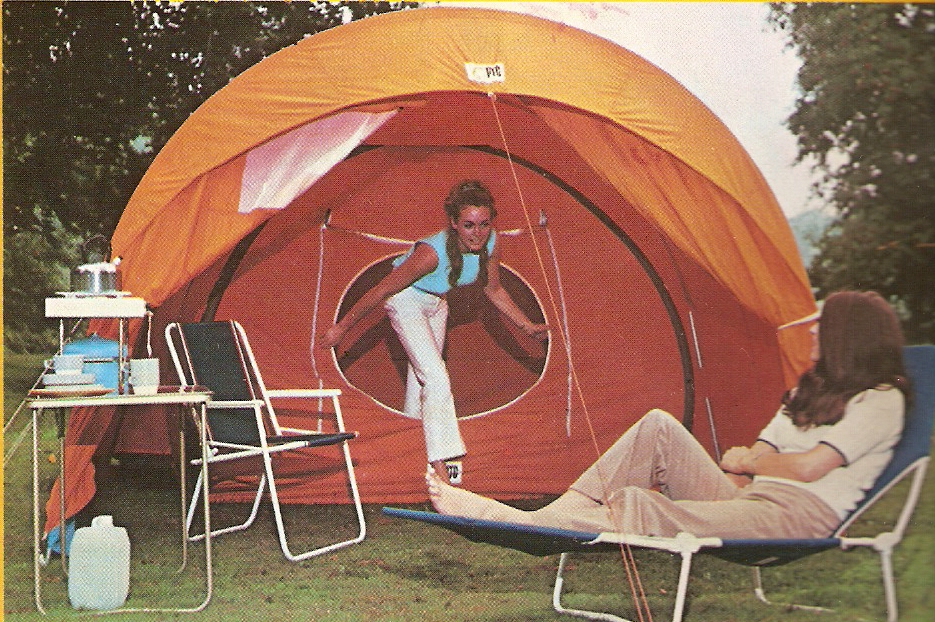 A couple wearing swimwear camping together A couple camping in swimwear