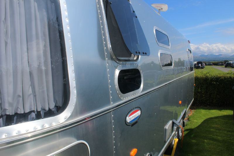 Airstream with a window open Opening a window on the Airstream