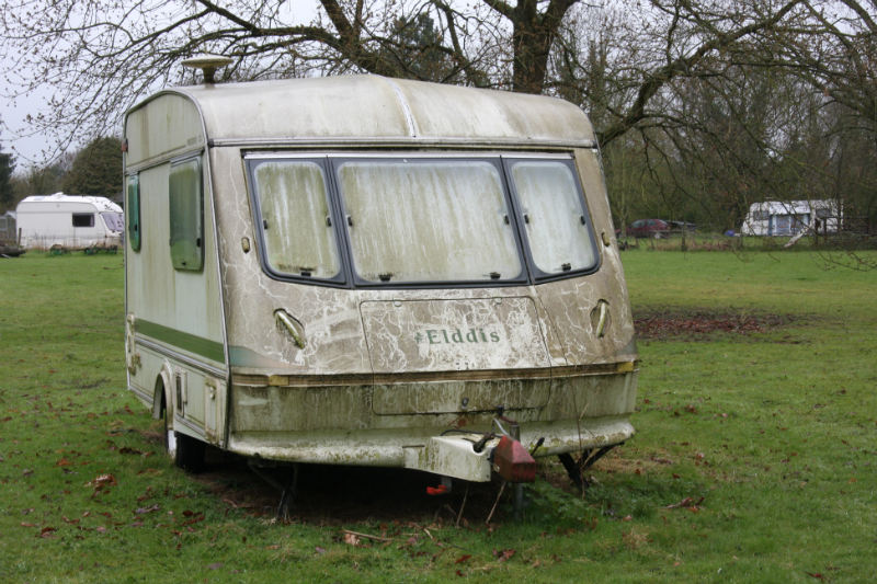 Caravan covered in algae