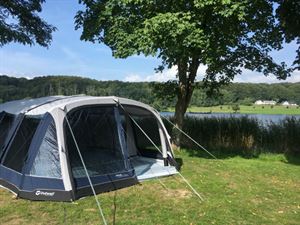 Family camping by a lake