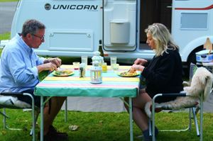Rowland and Monica Rivron having dinner outside their Bailey Unicorn Vigo