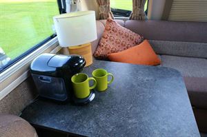 The coffee machine on the side table