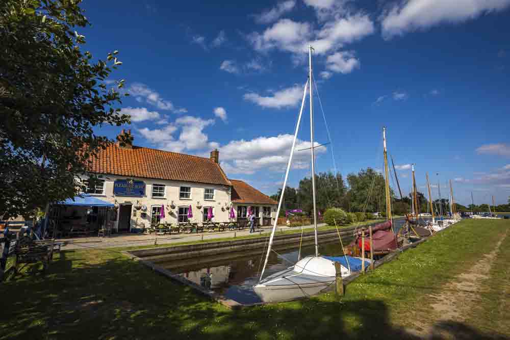 Image of a pub beside a river in the Norfolk Broads