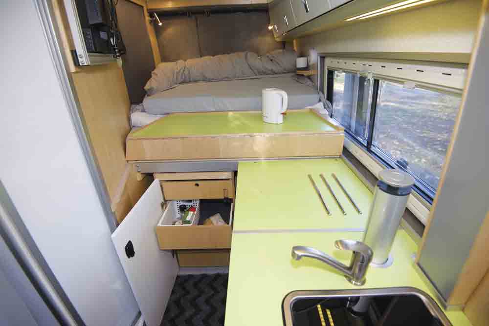 The edge of the bed flips up to create extra worktop space in the kitchen