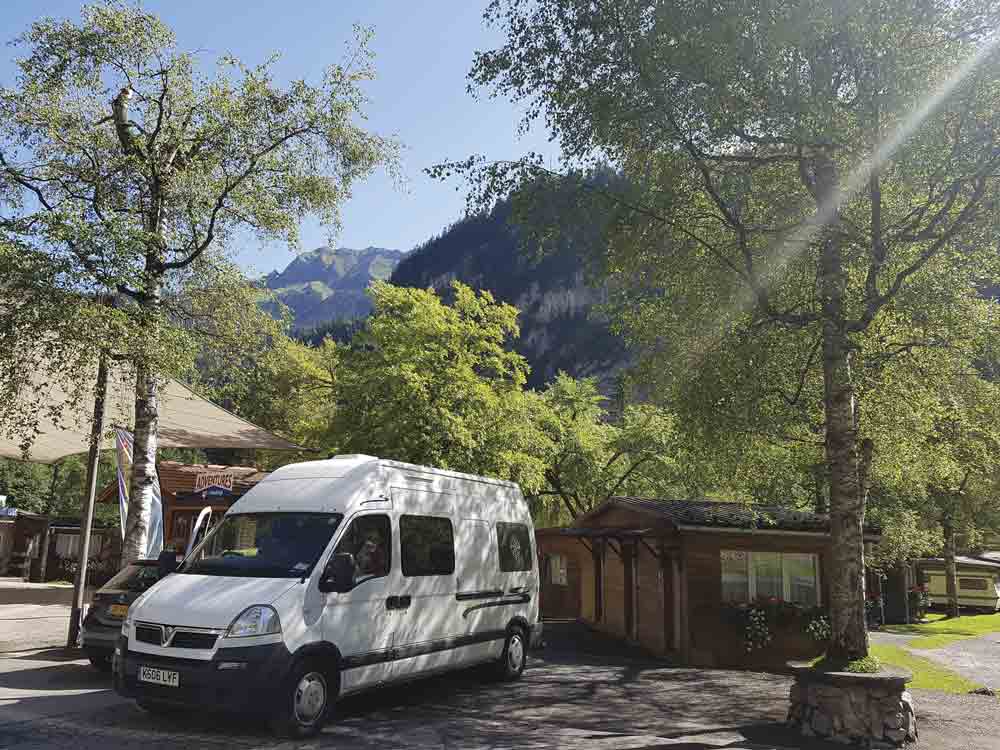 Image of a campervan outside a campsite