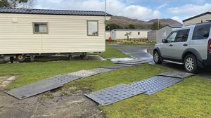 Matting is laid out to protect the turf