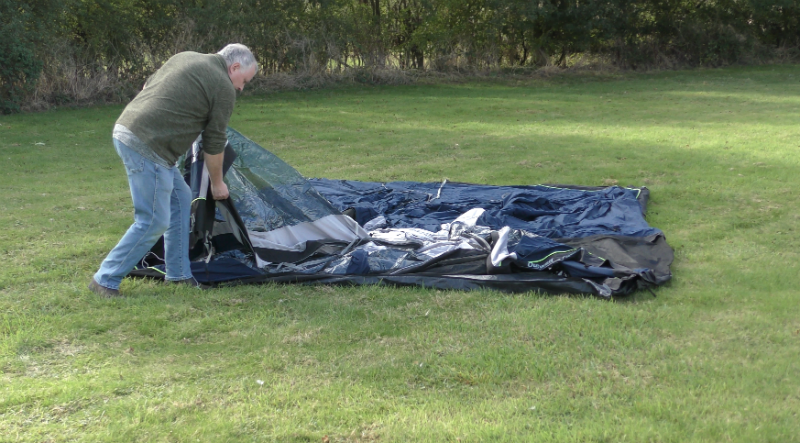 Unfold and lay the tent flat Unfold and lay the tent flat