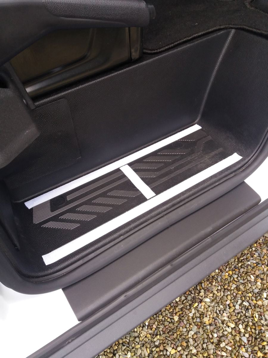 The hook part of the tape goes on the step