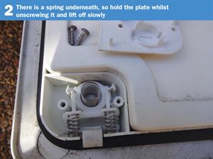 Motorhome Door Lock DIY 2: There is a spring underneath, so hold the plate whilst unscrewing it and lift off slowly