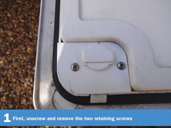 Motorhome Door Lock DIY 1: First, unscrew and remove the two retaining screws