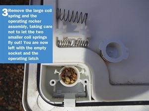 Motorhome Door Lock DIY 3: Remove the large coil spring and the operating rocker assembly, taking care not to let the two smaller coil springs fly out! You are now left with the empty socket and the operating latch