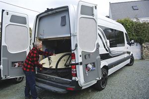 Alf's campervan has a large garage - perfect for transporting his surfboard