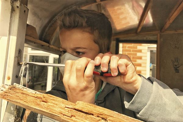 Lee's son Charlie tackles the task of window frame repairs Lee's son Charlie tackles the task of window frame repairs