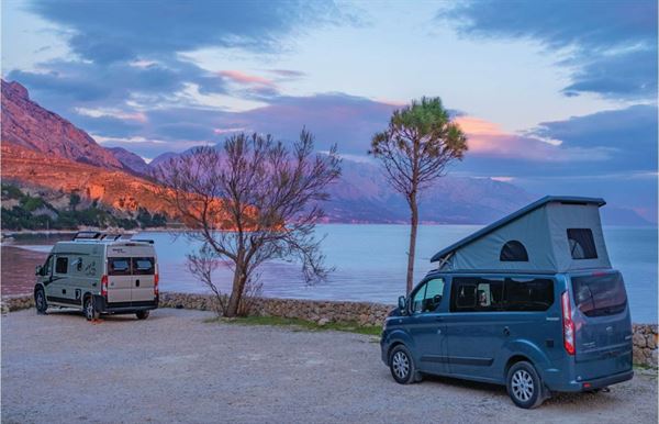 Campervans by a lake (photo courtesy of Shutterstock) Campervans by a lake (photo courtesy of Shutterstock)