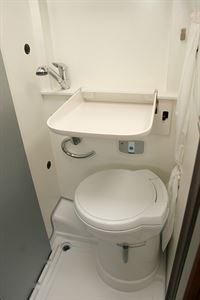 The washroom has a clever flip-up sink