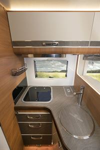 There's worksurface in the L-shaped kitchen area