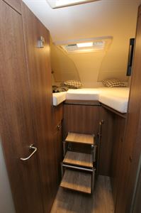 Twin single beds above the cab