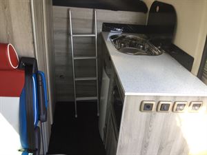 It has a compact side kitchen