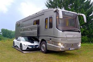 Volkner Performance S with sports car in garage
