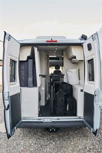 There is a fold-up rear transverse double bed that folds out of the way for more storage space