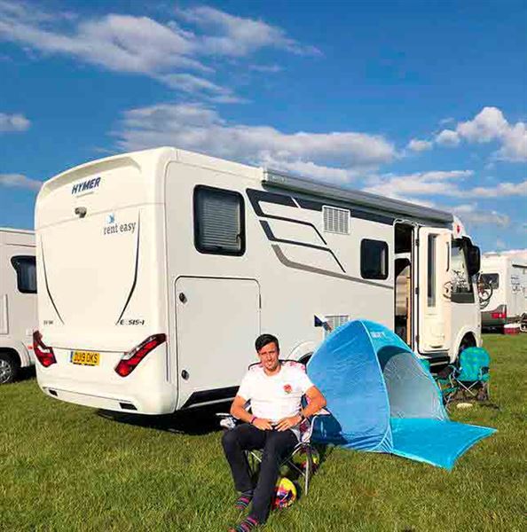 Burnley midfielder Jack Cork outside the Hymer Exsis i588 motorhome